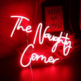 A glowing red qiaofei led naughty corner neon sign with white cursive letters usb powered for room or party decor