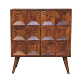 A mid-century modern quad cabinet made of warm brown mango wood with geometric 3d panel doors