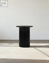 Qualls round side table in black with ribbed marble surface and smooth matte top offers financing options