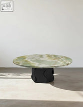 Quintero round coffee table with polished green marble top and sculpted black base solid wood marble coffee table