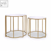 Rabia set of 2 metal side tables with gold finish and white marble tops featuring scalloped edges for upscale styling