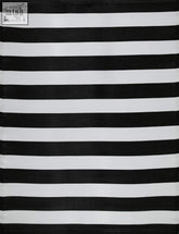 A rainbow outdoor rug with smooth black and white striped woven fabric perfect for outdoor use