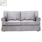 Gray upholstered two seat sofa with grey velvet fabric and matching back pillows for cozy seating