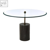 Rany glass and black marble side table with clear glass top and black marble base supported by a brass column