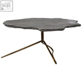 Rany grey stone coffee table with dark gray irregular solid stone top and bronze tripod base for stylish living room