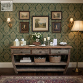 Rustic wooden console table with three drawers and metal handles in weathered gray recycled teak wood finish