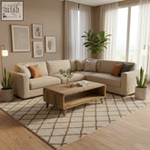 Beige sectional sofa with plush cushions and orange pillows next to a large recycled teak wood coffee table