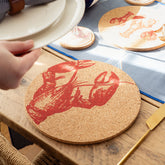 Circular cork place mat with bold red lobster illustration made from portuguese cork for stylish table settings