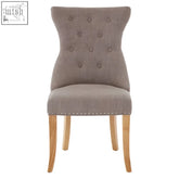 Beige tufted regents park mink linen dining chair with nailhead trim and light wooden legs