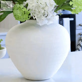 A regola matt white ceramic vase large with a rounded bulbous shape and subtle texture in matte white finish