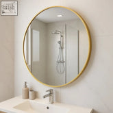 Round rei mirror 70cm with brushed gold finish metal frame mounted above white sink for bathroom use