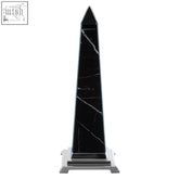 Renata large black marble design obelisk sculpture with white veining on a silver-toned metal base