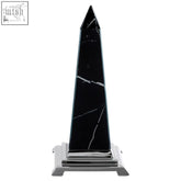 Renata small black marble design obelisk sculpture with white veining on a polished chrome base