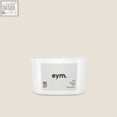 White cylindrical mini candle in minimalist container with gray eym label the sleepy one natural scent for rest