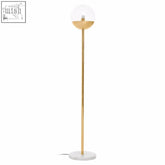 Revive gold finish metal floor lamp featuring a spherical glass globe and white marble base for stylish lighting