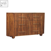 Rustic ridgefront chest of drawers with ribbed drawer fronts and brass handles in amber oak finish