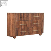 Brown wooden ridgefront chest with roasted almond finish fluted drawer fronts and brass handles on rounded ball feet