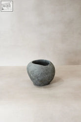 Matte gray rounded river stone planter pot with handcrafted texture perfect for direct planting and indoor use