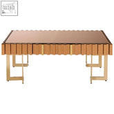 Gold-toned rivoli coffee table with mirrored top and vertical slats perfect for stylish living room setups