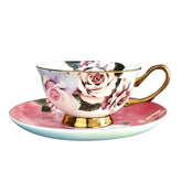 Delicate rosette majesty bone china teacup and saucer with pink roses and gold trim on fine bone china white background