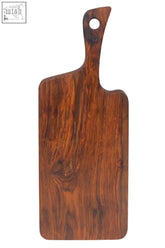 Rosi organic warm-toned tropical rosewood cutting board with smooth natural finish and visible grain pattern
