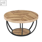 Round coffee table with light wood veneer herringbone top and black metal legs featuring a lower shelf