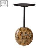 Rova side table with black metal pedestal, mosaic sphere base of golden brown shell pieces, iron pole, and white segments
