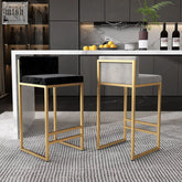 Two ruby bar stools with gold wrought iron frames, one black velvet and one light gray fabric, featuring high density cushions