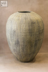 Textured muted green ceramic vase with vertical ridges and flared rim in rustic indonesian pot style xl no 32