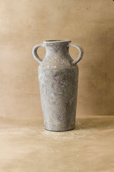 Rustic indonesian tall gray ceramic pot with textured surface and two looped handles for nature-inspired interiors