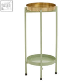 A sleek two-tiered plant stand with a matte sage green metal frame and gold two-tiered plant trays for decor