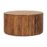 Rounded wooden saffron rattan coffee table with woven cane top and vertical wood slats perfect for living room
