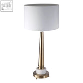 Sakida classic table lamp with white cylindrical shade and brass stem on a white marble base classic table lamp