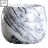 A sleek rounded salerno grey marble mortar and pestle with smooth white and gray veined surface