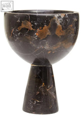 A salmo small black marble pedestal bowl in dark brown with golden brown veining on a matching tapered base