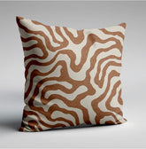 A sandstone wiggle throw cushion with bold brown and cream wavy lines on textured fabric perfect for scatter cushions