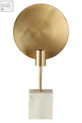 Saramis table lamp with gold-toned circular shade and white marble base on a slender stem for stylish lighting