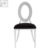 White oval-backed sarita stackable silver dining chair with black velvet padded seat for stylish comfort