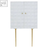 White satara two door cabinet with gold-tone legs and knobs made of solid mango wood in art deco style