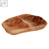 Natural wood serving dish with smooth irregular surface and visible grain in warm brown cedar wood