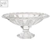 Clear glass fruit bowl with wide lip featuring a scalloped rim and faceted design on a pedestal base