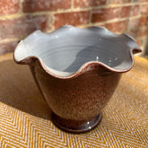 Scalloped brown ceramic vase with ruffled glazed rim and speckled finish perfect for home decor