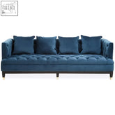 Deep blue velvet sefra 3 seat navy fabric sofa with tufted upholstery and matching throw pillows