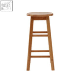 Light brown selby natural tropical hevea wood bar stool with round seat and four legs connected by slats