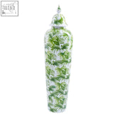A tall white ceramic selva small botanic jar with green palm frond patterns and a matching lid