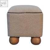 Beige fuzzy fabric storage ottoman with handwoven upholstered design and unique rounded wooden ball feet