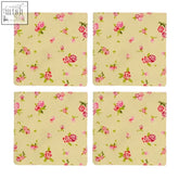 Set of four rose cottage cotton coasters with pink roses and green leaves on a soft cream background