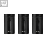 Set of three clear and black storage jars with sleek black glass and matte-finished lids featuring vertical oval windows