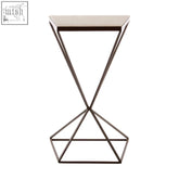 Shalimar trapezoid side table with sleek mirrored top and black metal frame features dynamic angles and modern design