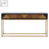 Siena console table with black top, gold console legs, and three drawers featuring geometric brass wood inlays